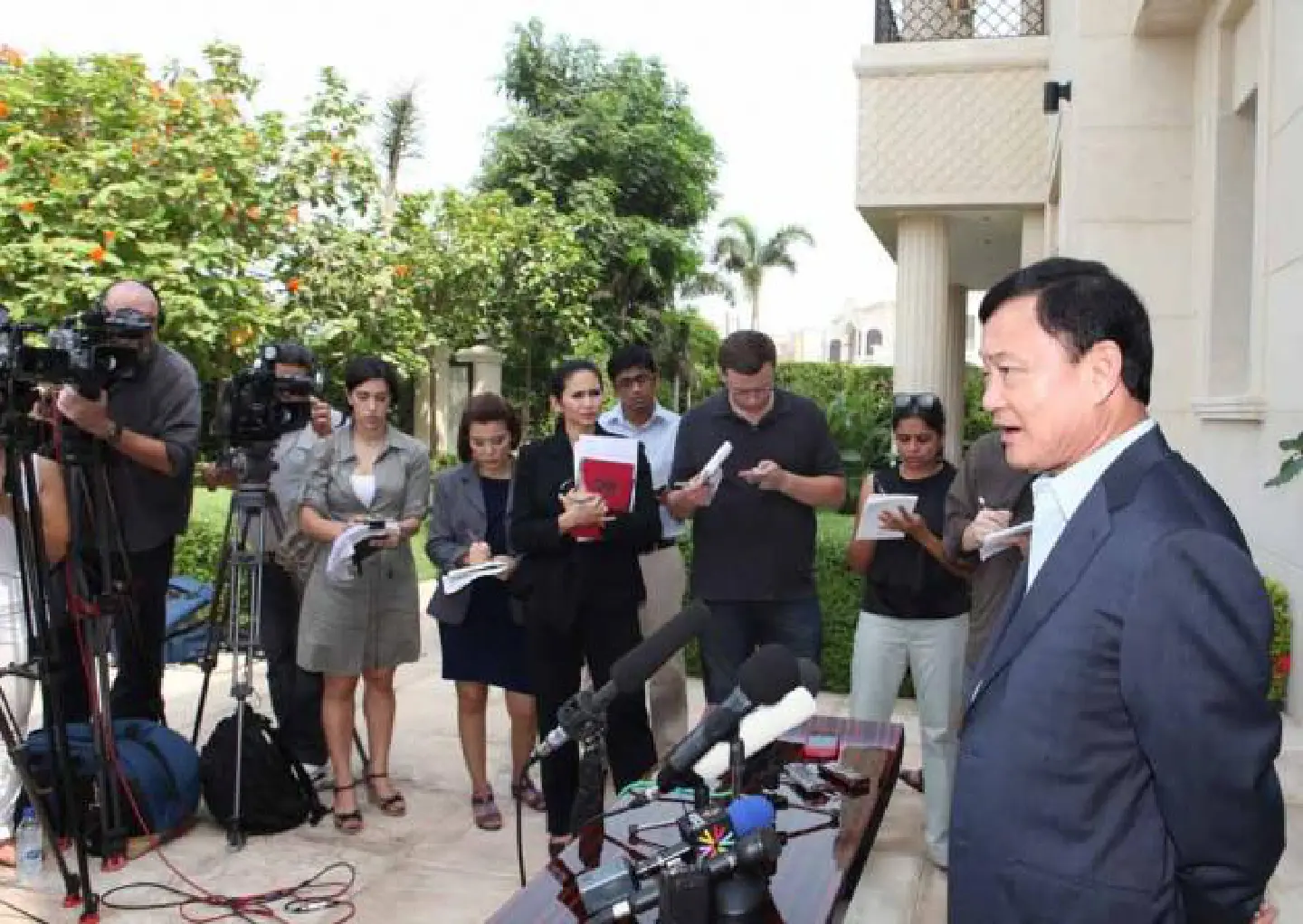 Thaksin's retreat may cut conflict Thaksin's retreat may cut conflict