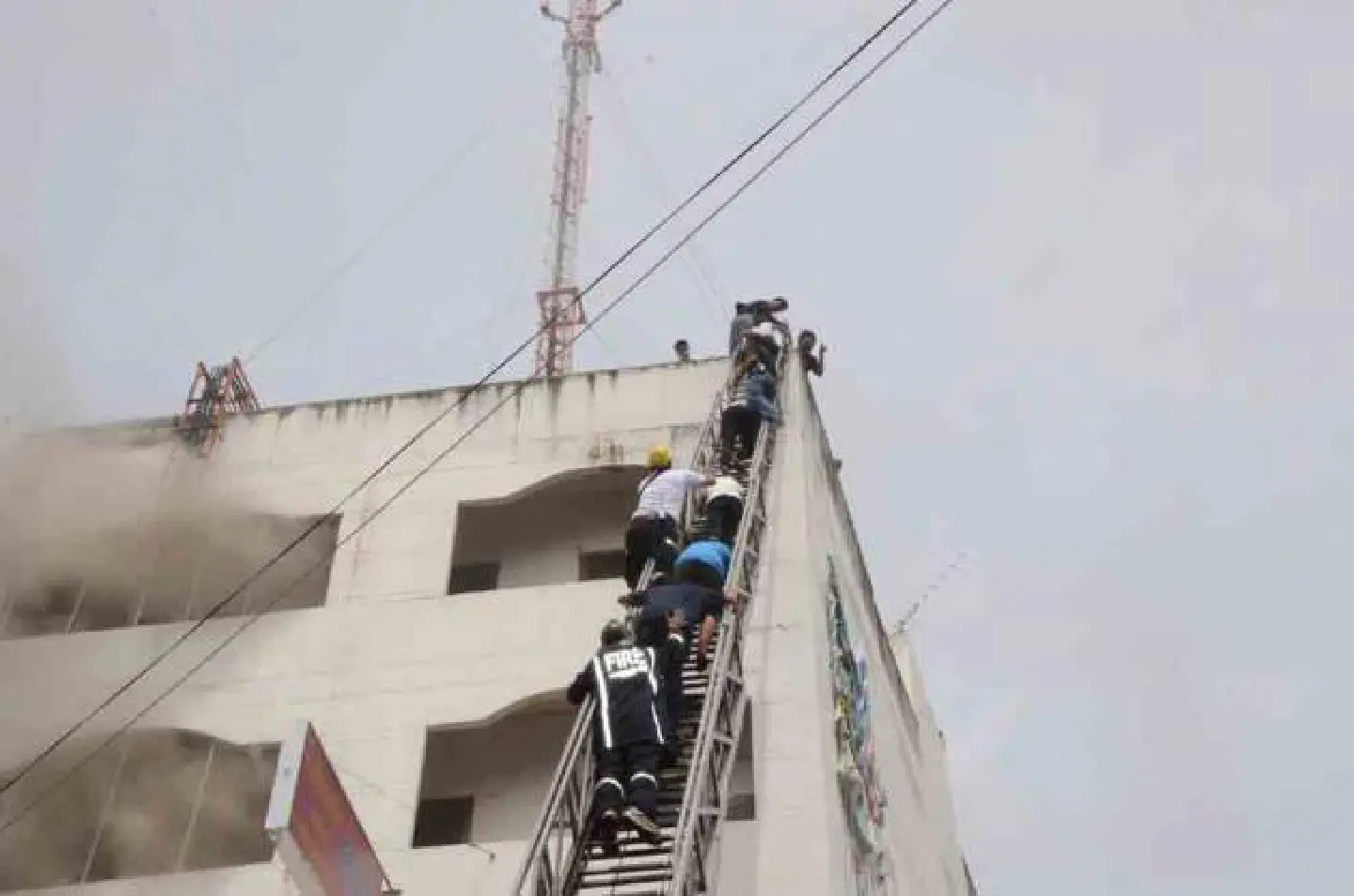 Roof rescue as fire hits 'school' Roof rescue as fire hits 'school'
