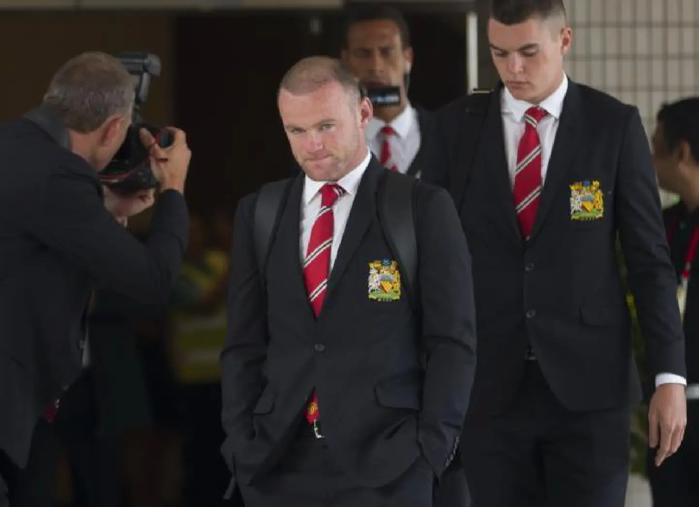 Injured Rooney heads back home
