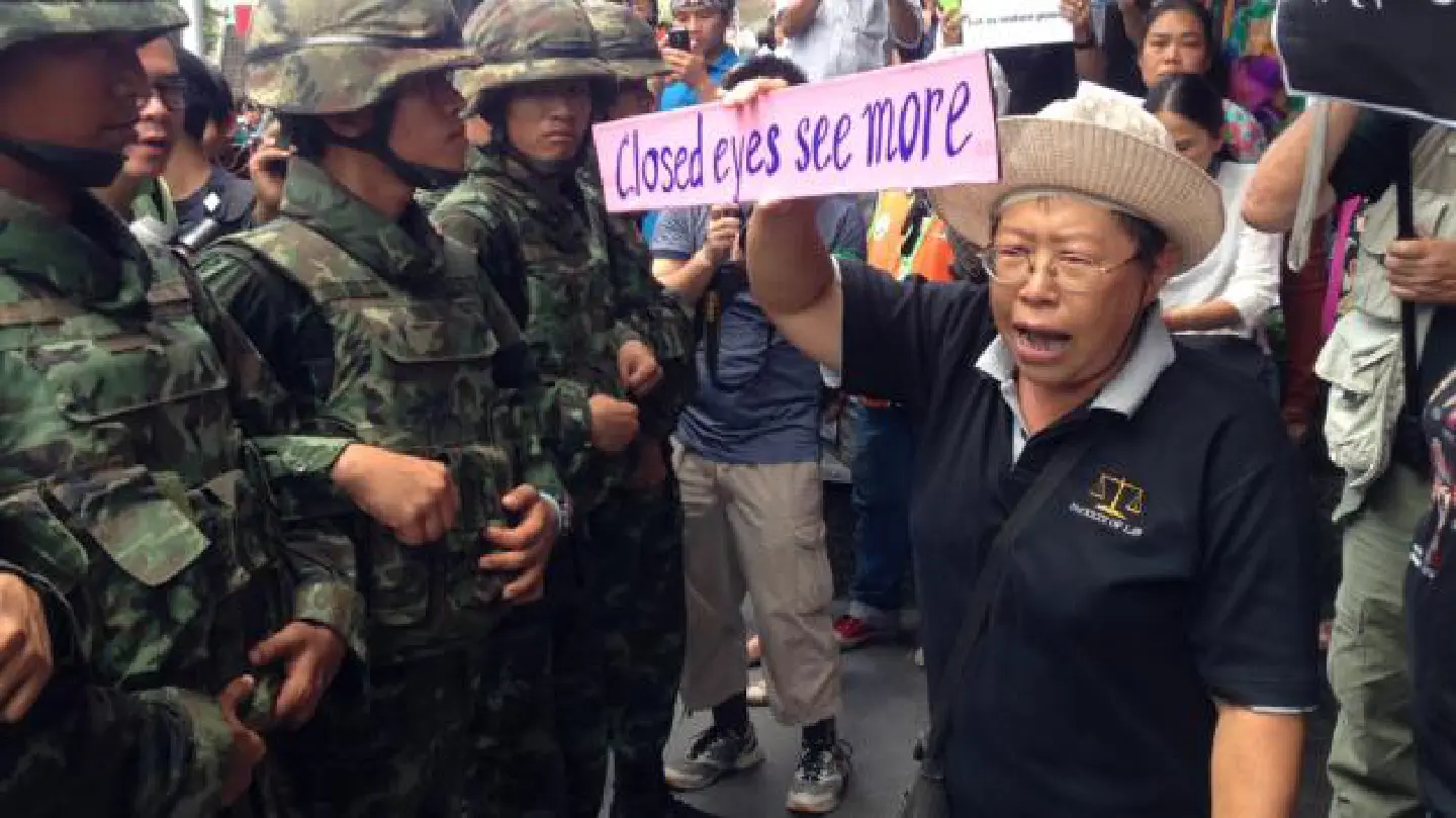 About 100 people rally against coup About 100 people rally against coup