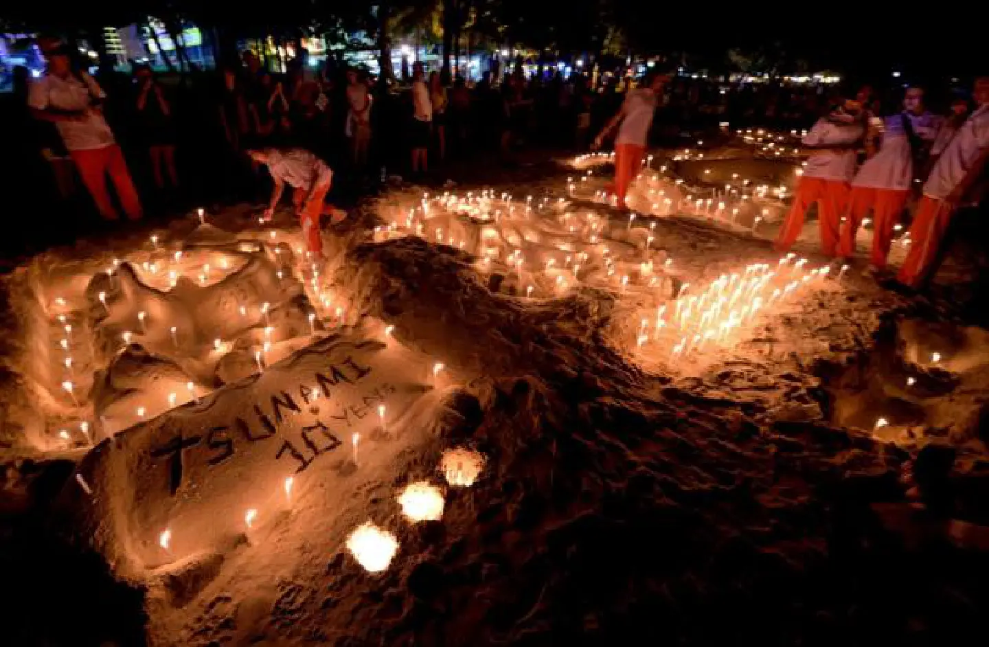 Candles, prayers and tears as Asia mourns tsunami dead 10 years on Candles, prayers and tears as Asia mourns tsunami dead 10 years on