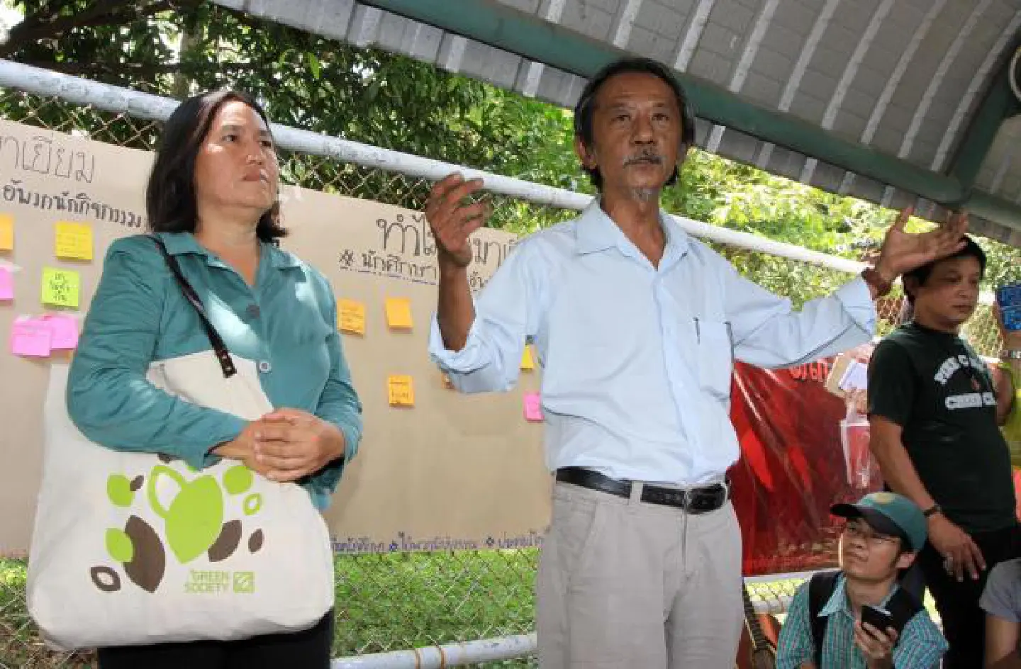 Activists sing for their son, outside jail