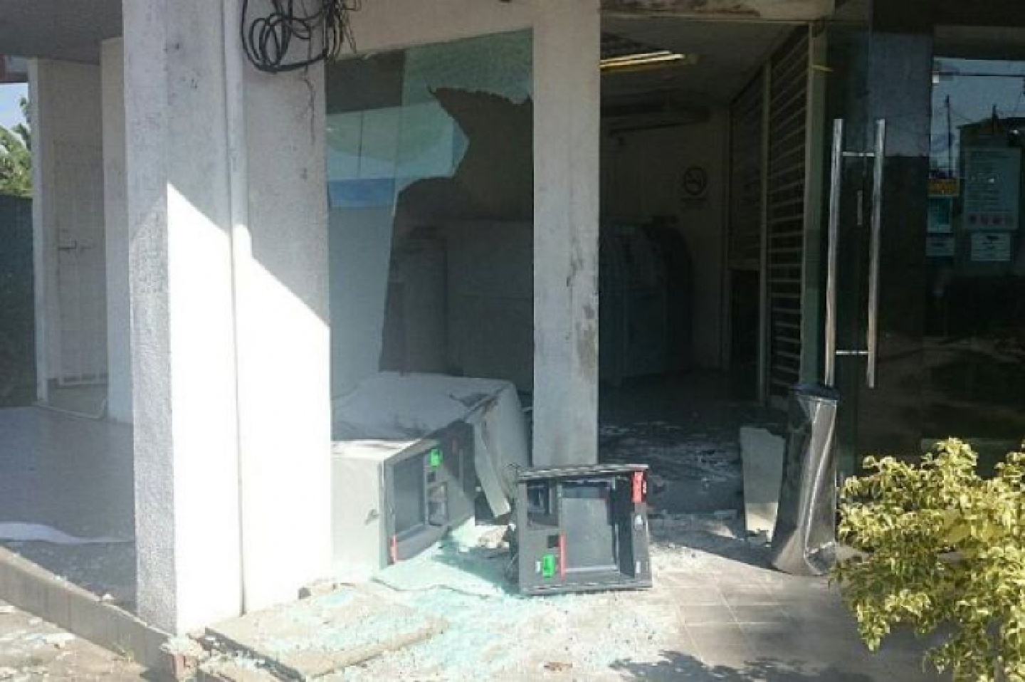 Thieves cart away two ATMs using excavator Thieves cart away two ATMs using excavator