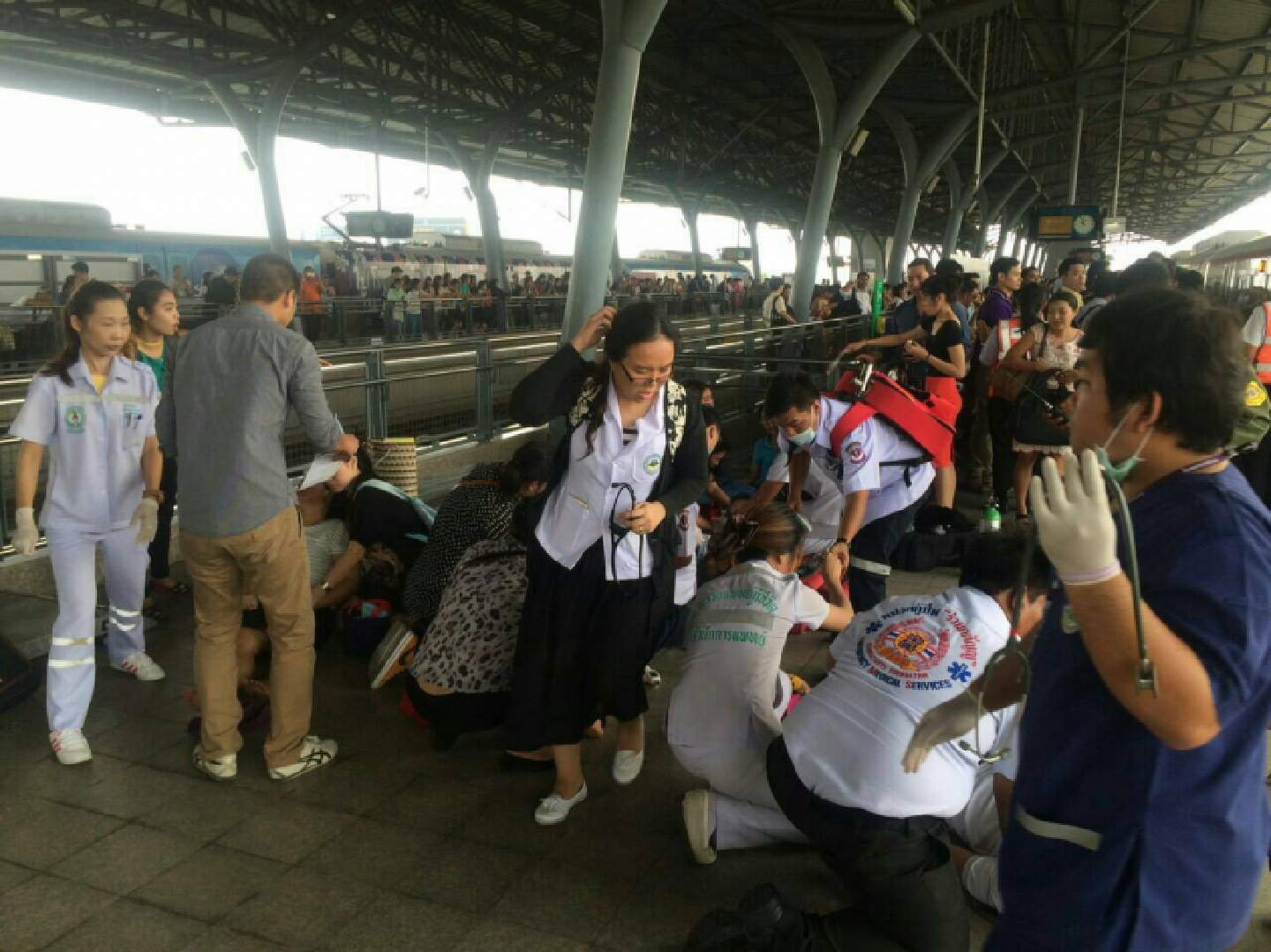 Panic passengers walk on Airport Rail Link railway