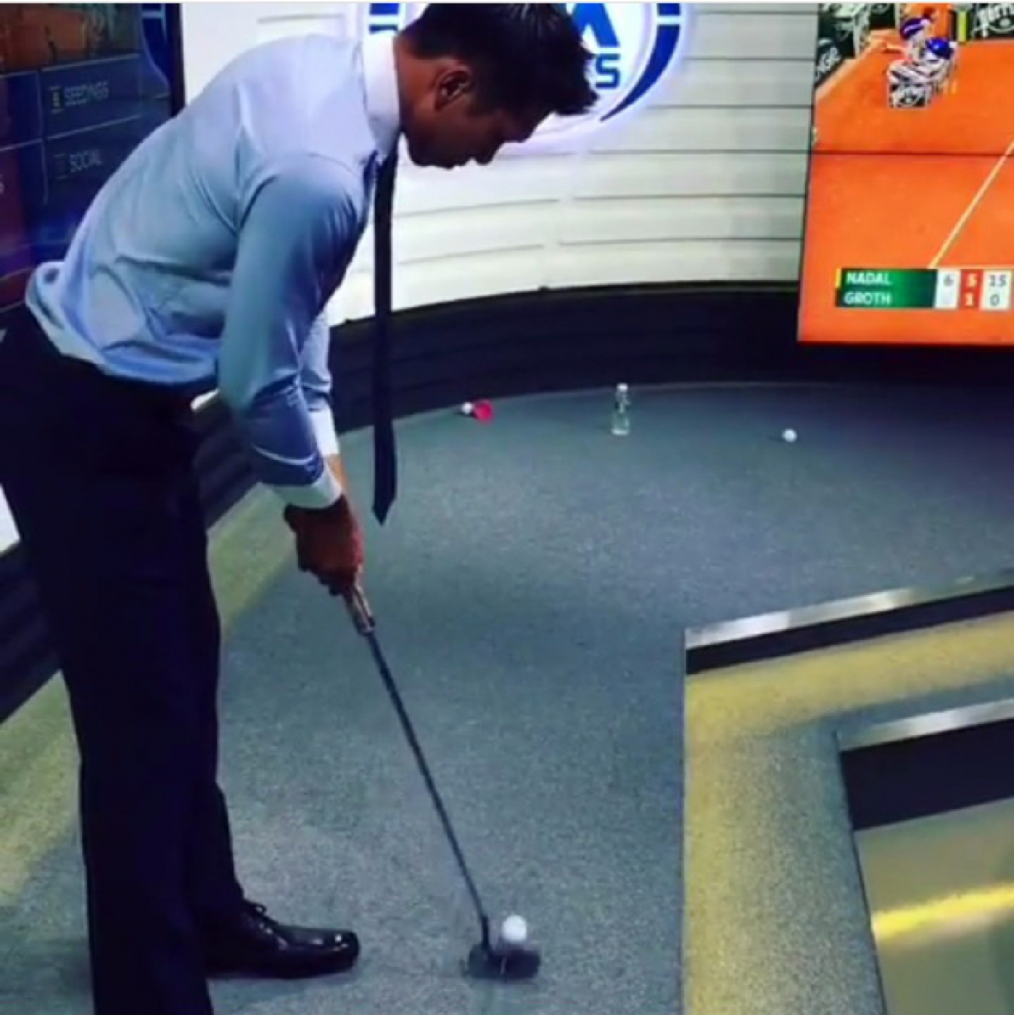 Golf Addict Paradorn Practises Golf in Studio. Golf Addict Paradorn Practises Golf in Studio.