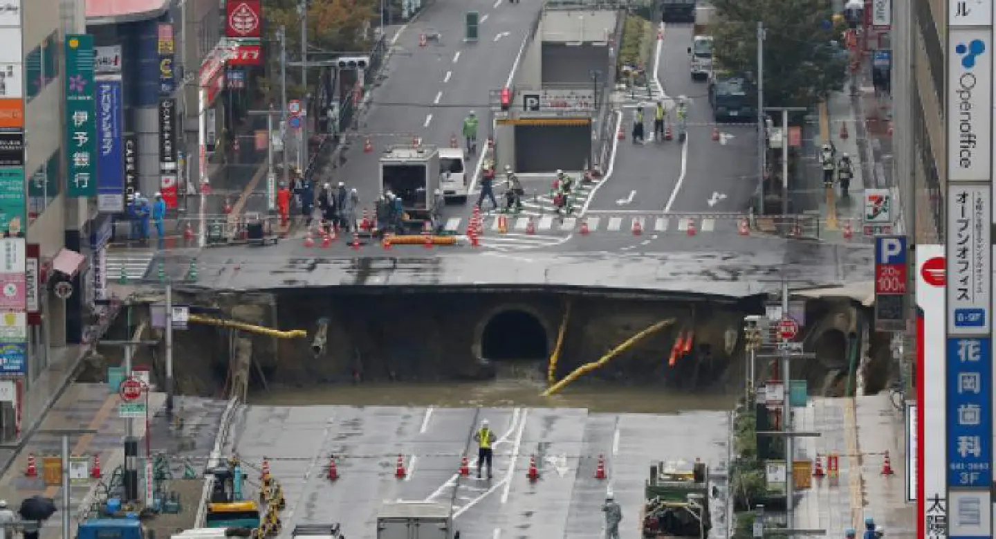 Giant sinkhole swallows Japan city street Giant sinkhole swallows Japan city street