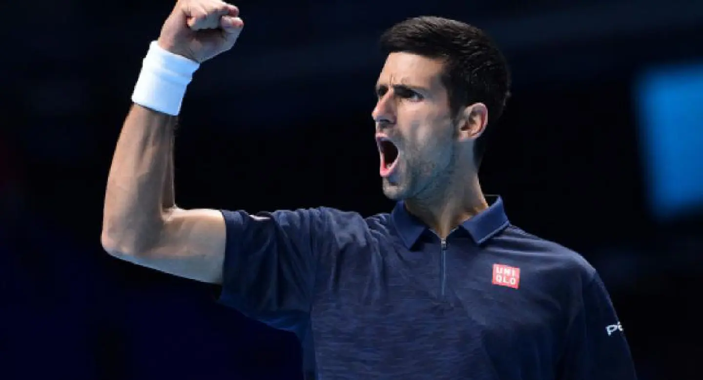 Djokovic beats Raonic to book last four spot at Tour Finals Djokovic beats Raonic to book last four spot at Tour Finals