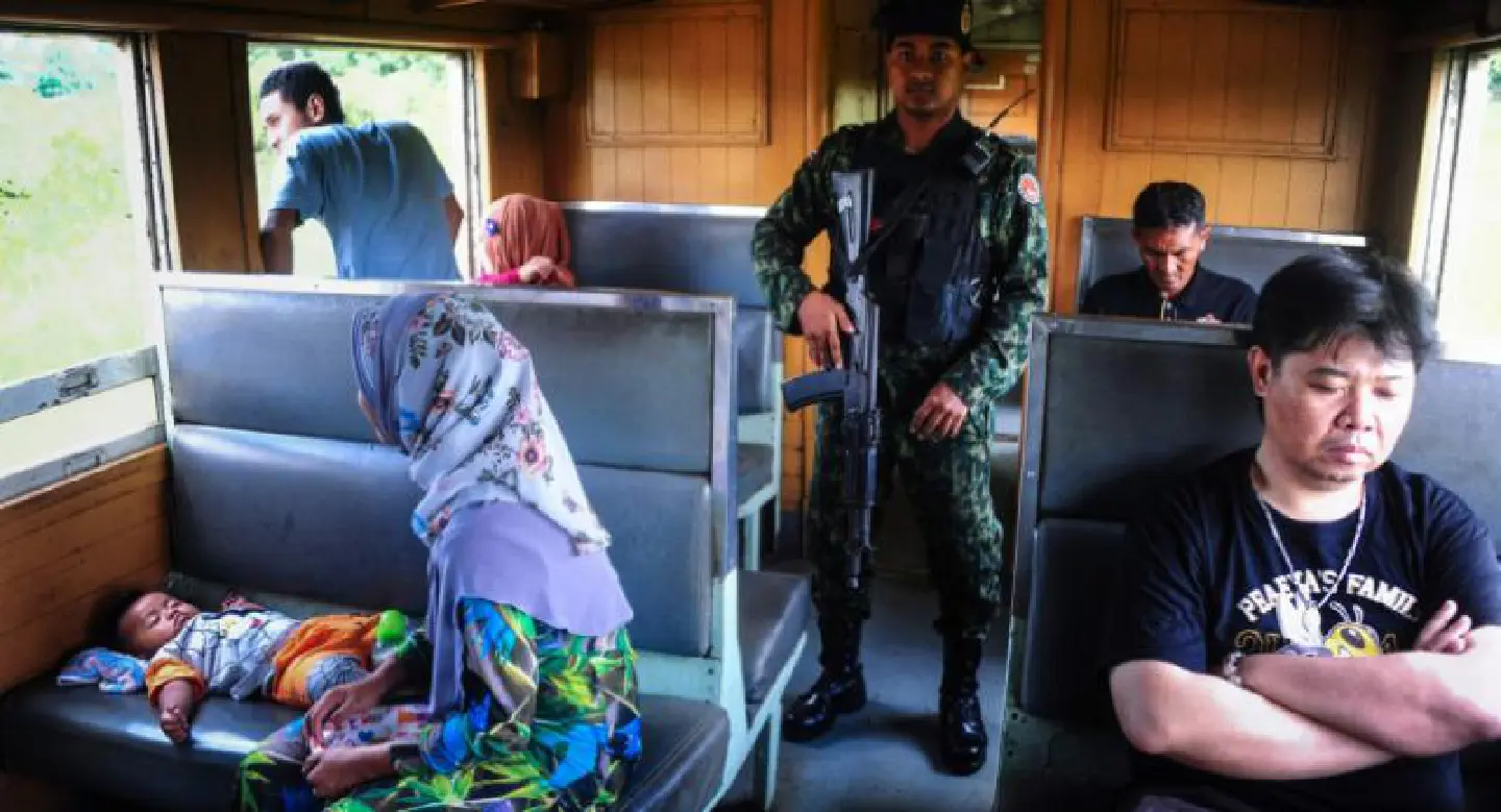 God and good luck guide commuters on rebel-hit Thai train God and good luck guide commuters on rebel-hit Thai train