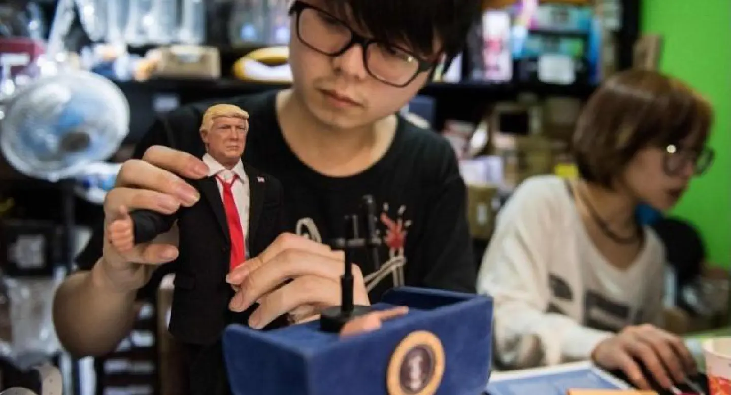 Hong Kong doll maker toys with Trump Hong Kong doll maker toys with Trump