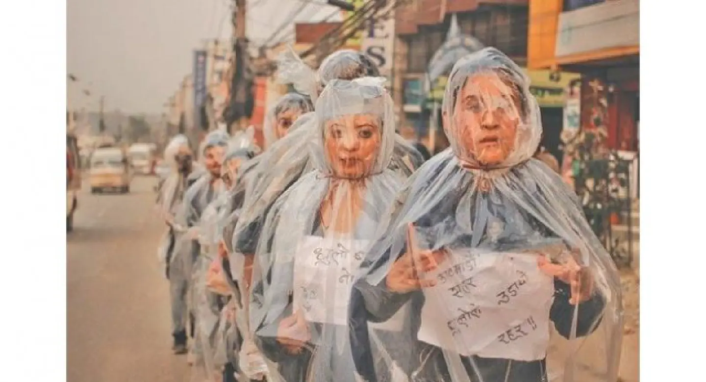 Wrapped in plastic sheets, students talk pollution on streets Wrapped in plastic sheets, students talk pollution on streets