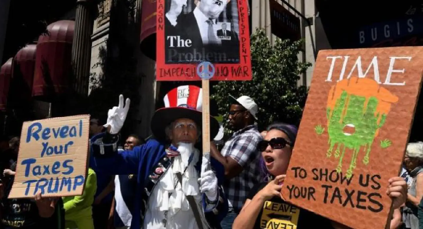Trump hits back at tax protests, asks 'who paid' for rallies Trump hits back at tax protests, asks 'who paid' for rallies
