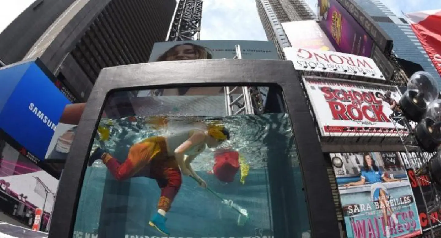 Aquarium art brings climate debate to NY Times Square Aquarium art brings climate debate to NY Times Square
