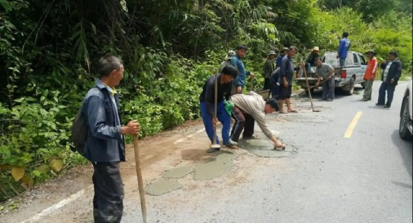 Villagers join forces to repair main road Villagers join forces to repair main road