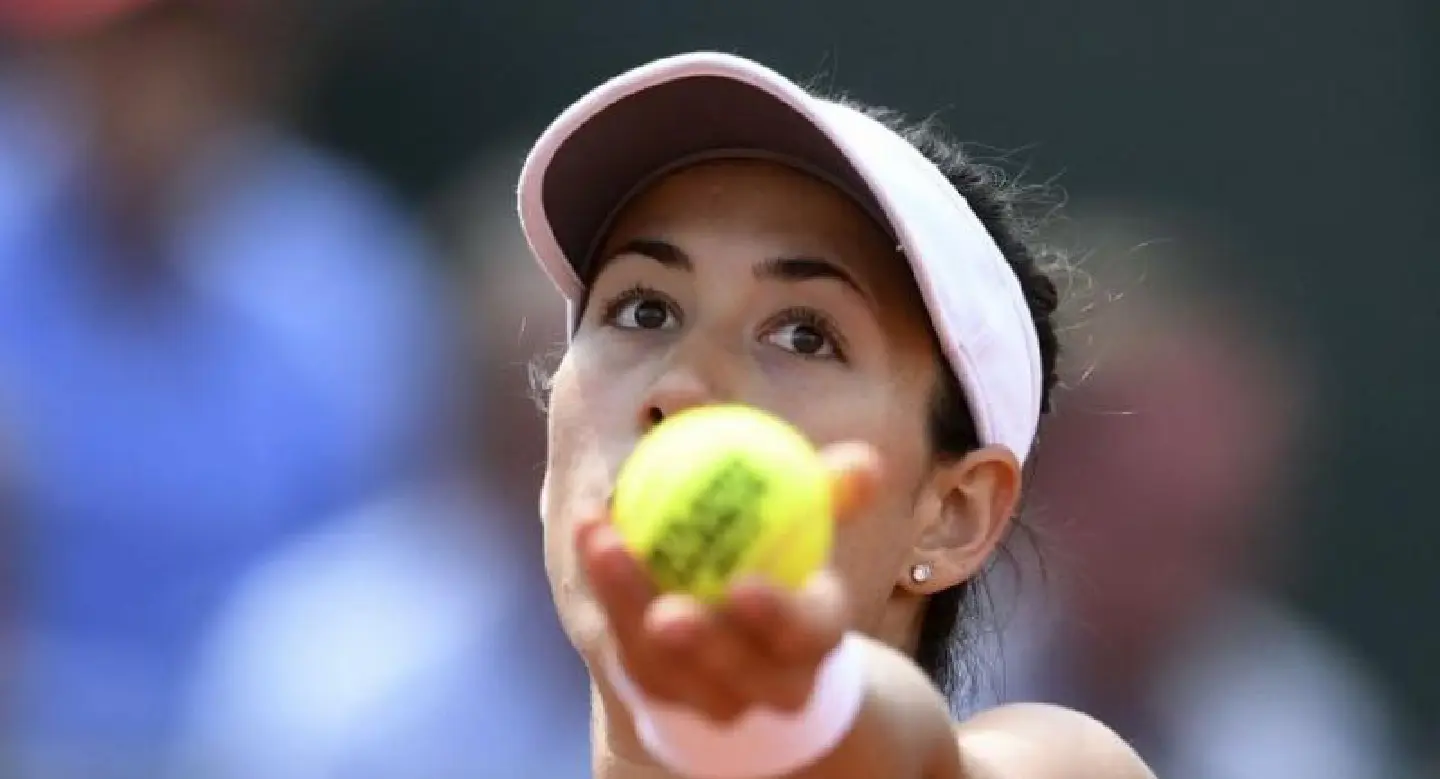 Muguruza survives scare in taking first step on grass Muguruza survives scare in taking first step on grass