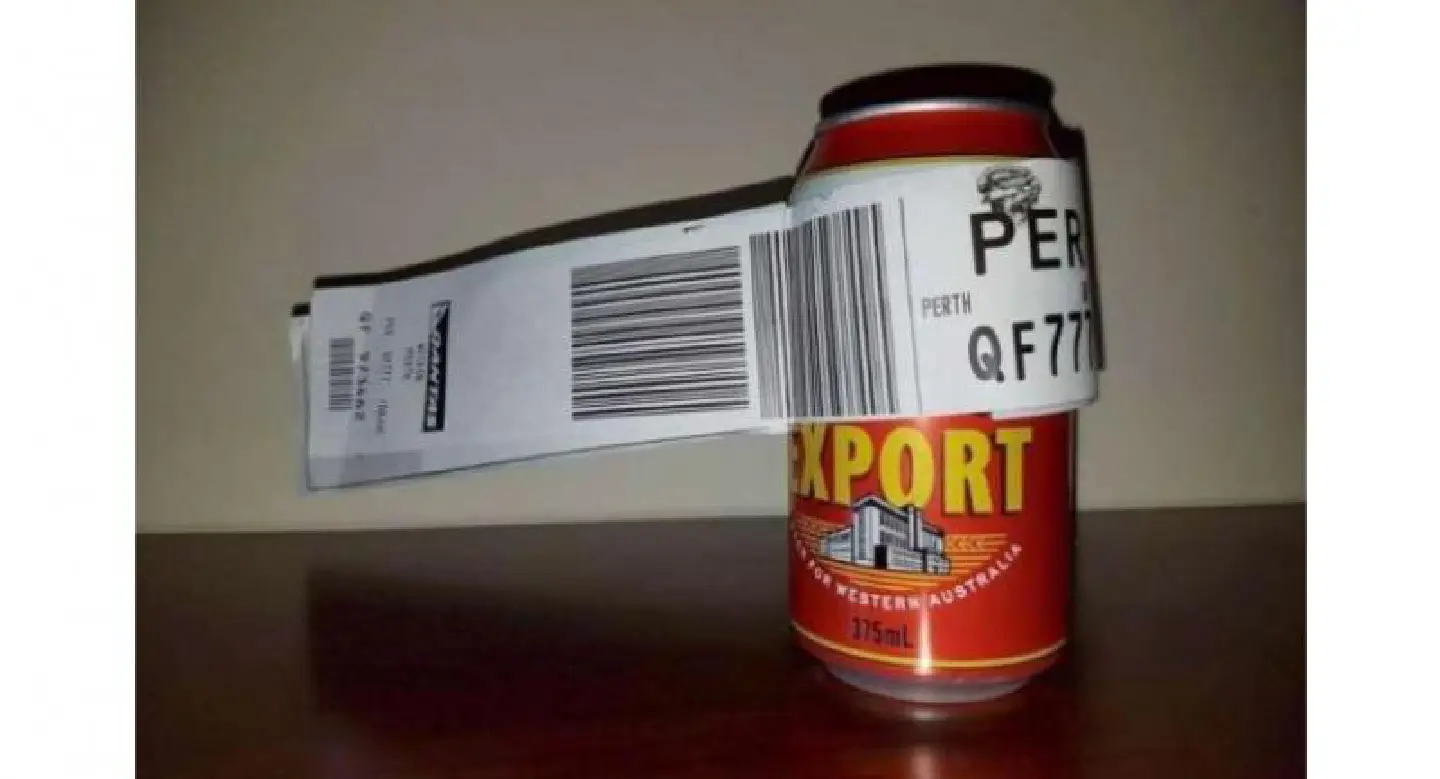 Aussie swaps suitcase for a can of beer as his only check-in luggage Aussie swaps suitcase for a can of beer as his only check-in luggage
