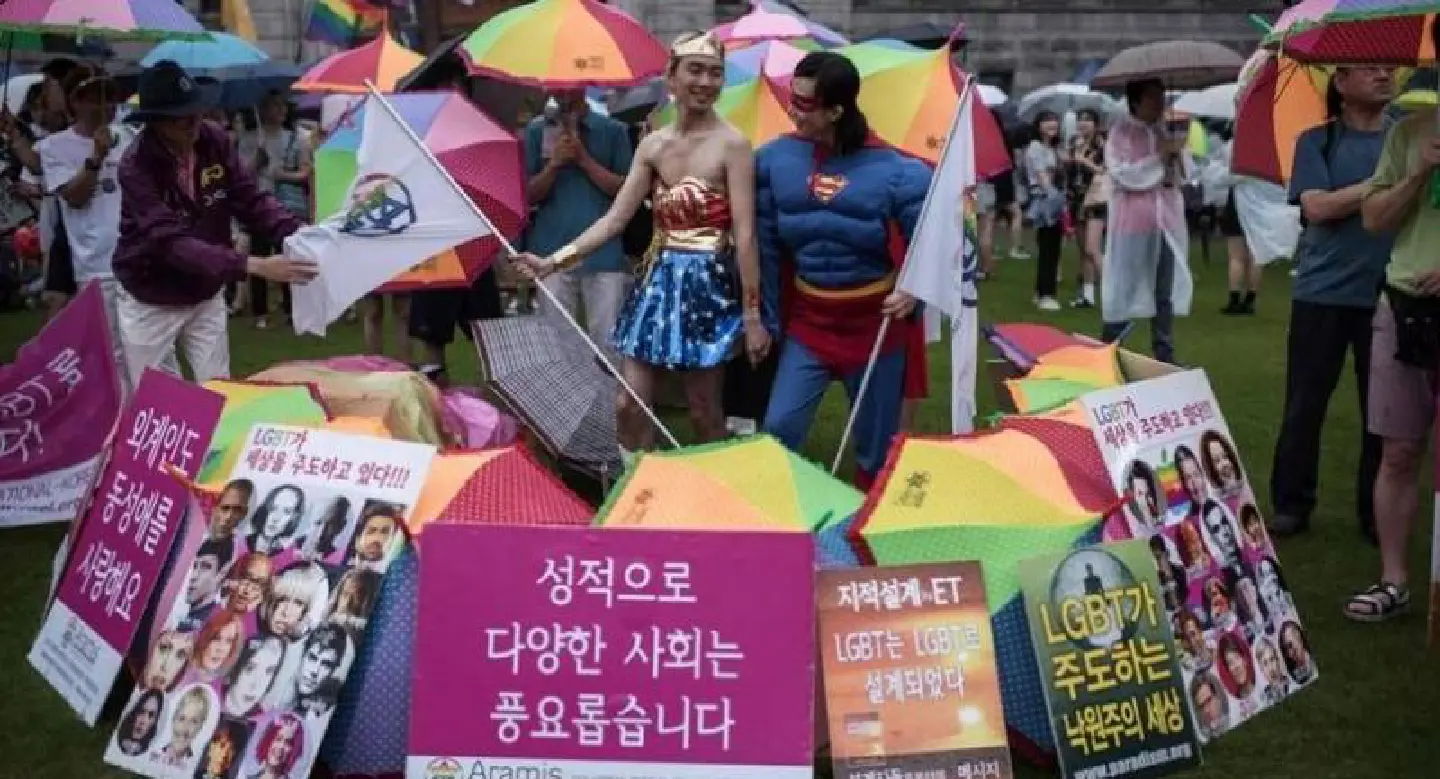 Gay rights supporters parade amid rain, protests in Seoul Gay rights supporters parade amid rain, protests in Seoul