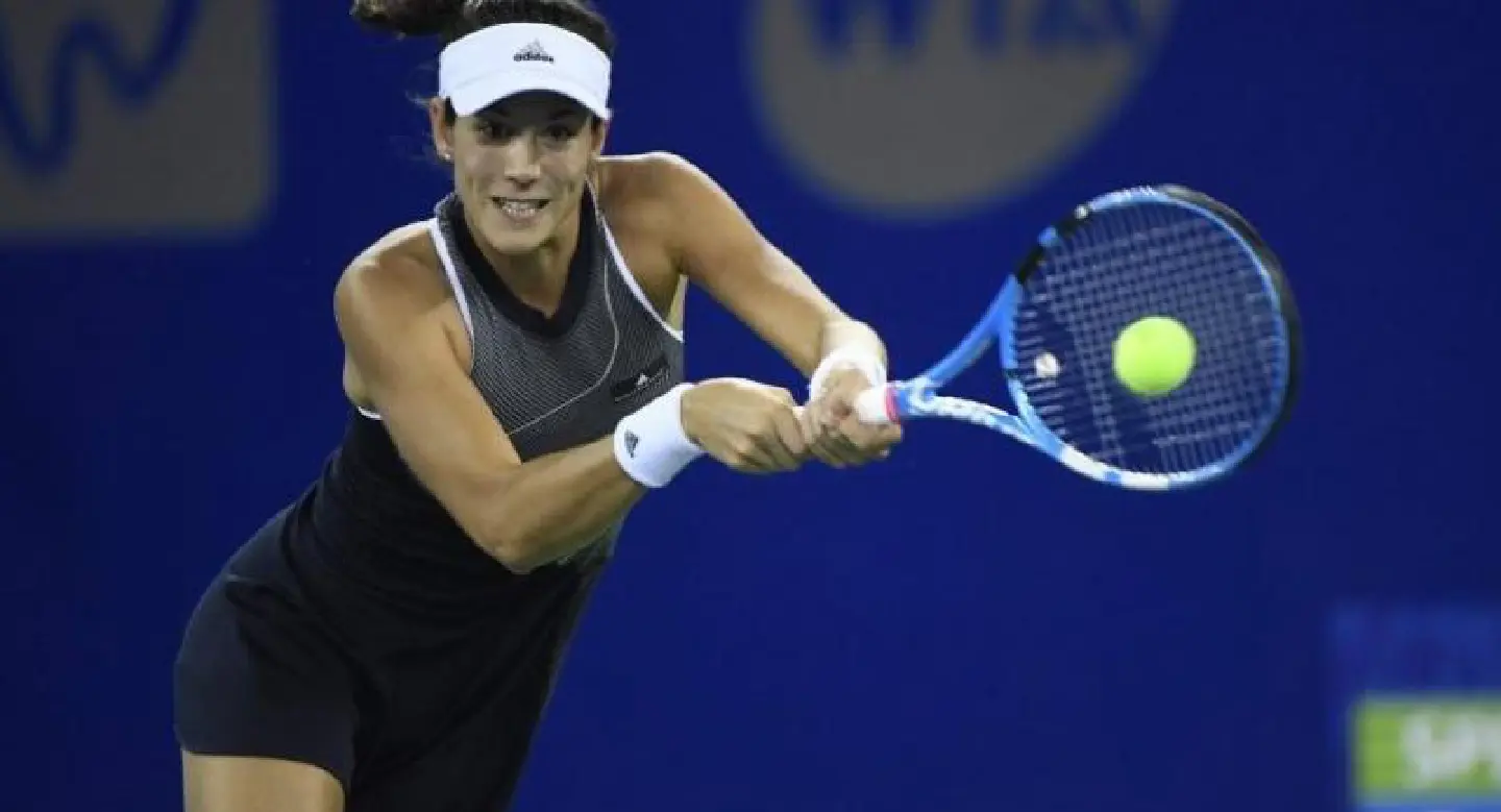 World number one Muguruza powers into Wuhan quarters World number one Muguruza powers into Wuhan quarters