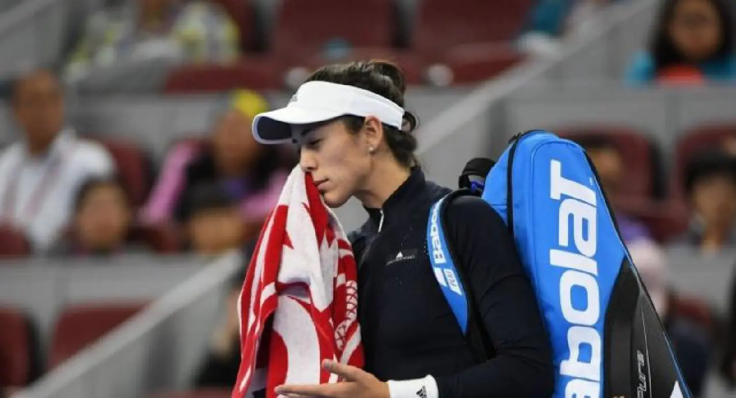 Virus-hit Muguruza retires in China Open first round Virus-hit Muguruza retires in China Open first round