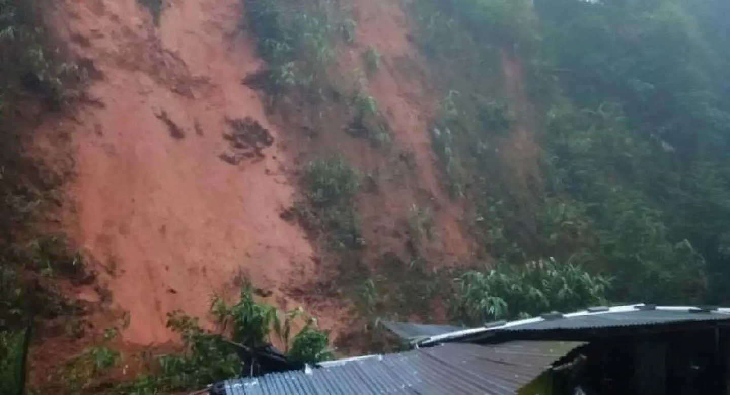 Man dies after landslide buries shophouse Man dies after landslide buries shophouse