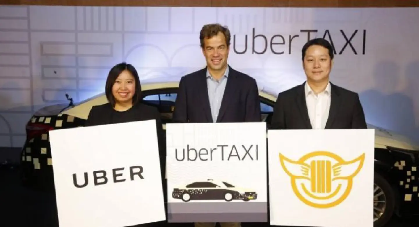 Uber partners with taxi operator Uber partners with taxi operator