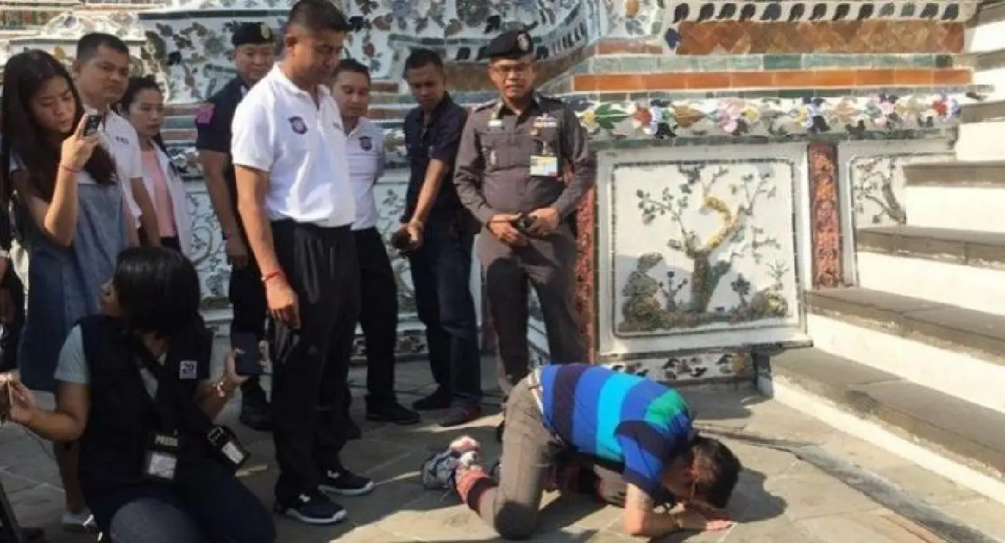 Guide arrested for stepping on Temple of Dawn stupa Guide arrested for stepping on Temple of Dawn stupa