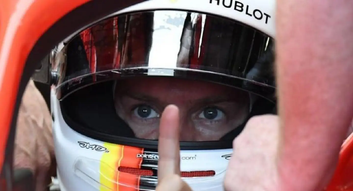 Three in a row for Vettel, Hamilton shares front row
