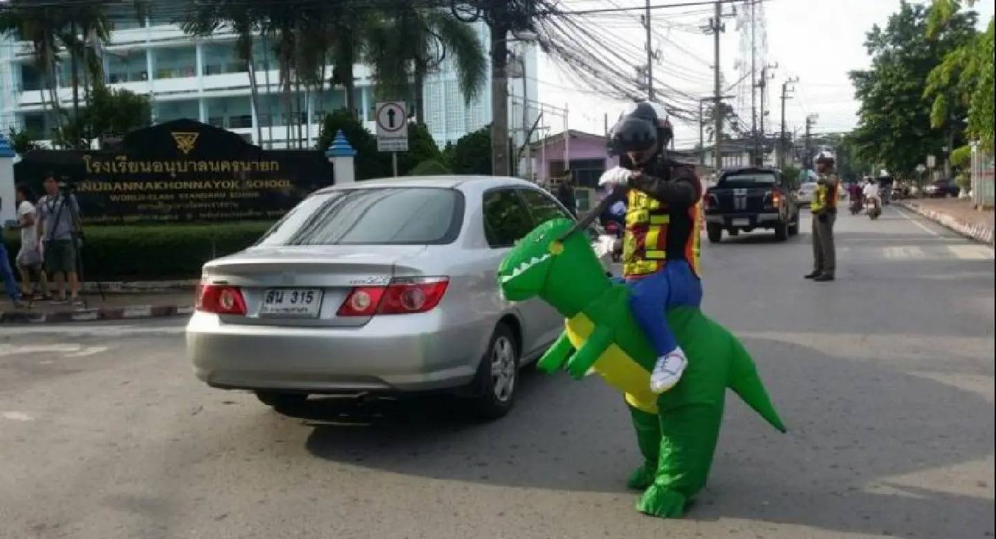 Doyouthinkhesaurus: Thai 'T-Rex' cop gives traffic safety lessons Doyouthinkhesaurus: Thai 'T-Rex' cop gives traffic safety lessons