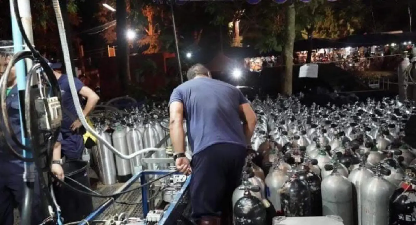 Officials refilling 766 oxygen tanks for rescue divers Officials refilling 766 oxygen tanks for rescue divers
