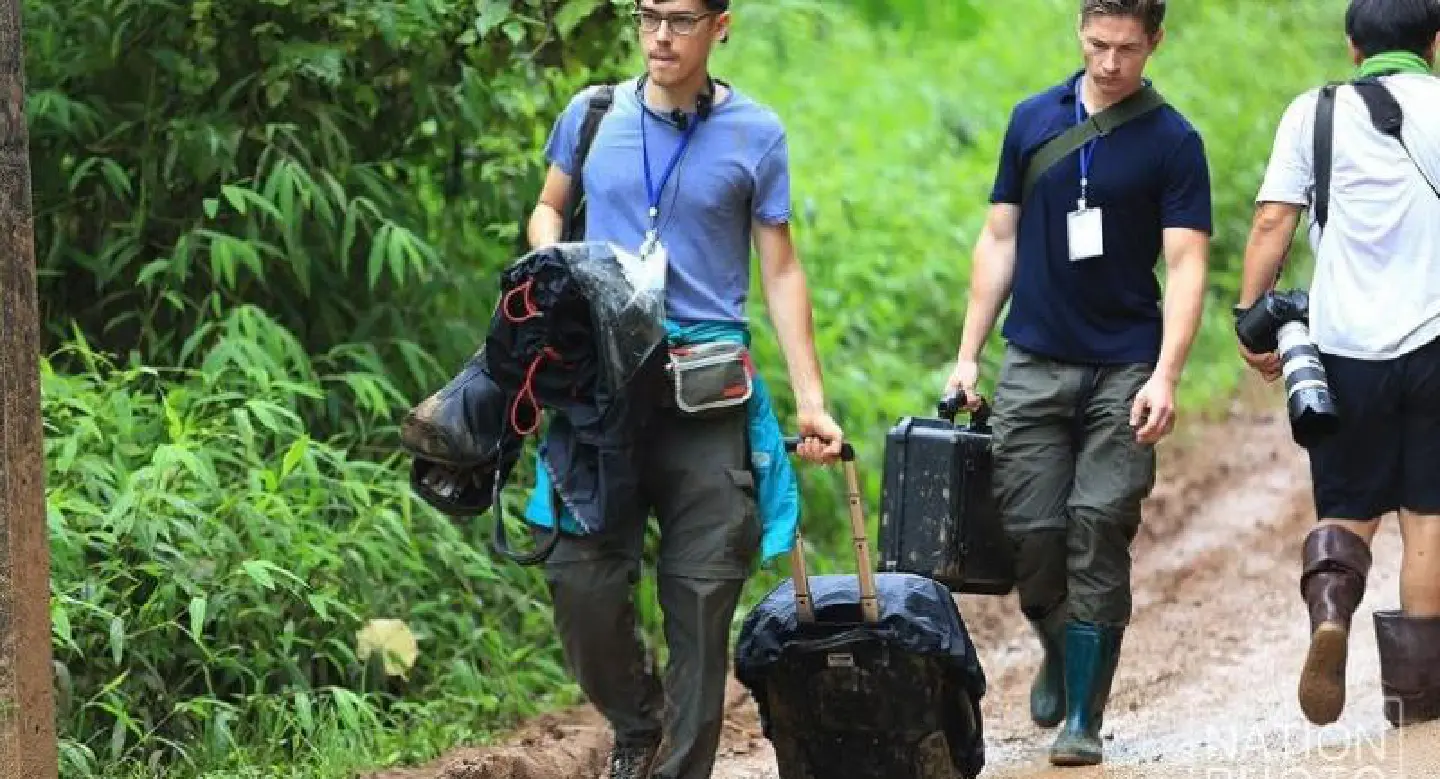 World media moved back from cave as evacuation begins World media moved back from cave as evacuation begins