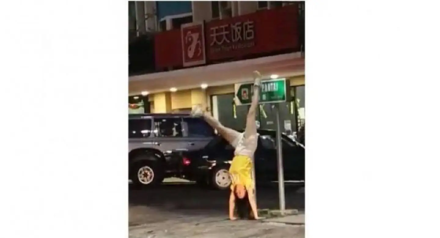 Viral video, photo of Chinese tourists doing handstands irks people online Viral video, photo of Chinese tourists doing handstands irks people online