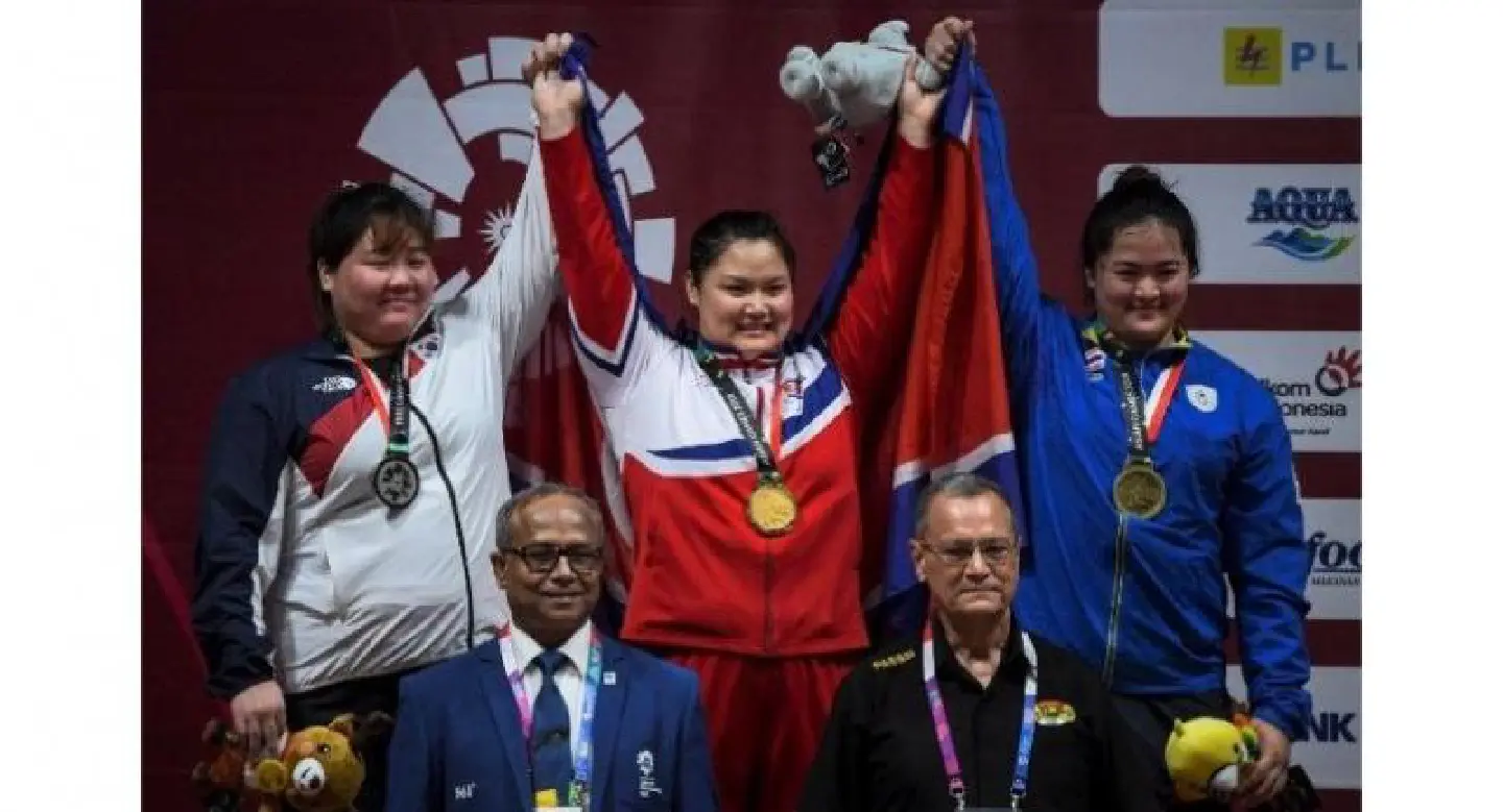North Korea win eighth weightlifting gold then celebrate alongside South North Korea win eighth weightlifting gold then celebrate alongside South