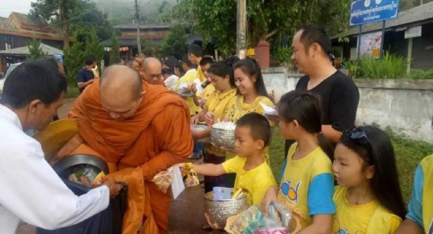 Thais give alms in memory of their beloved King Thais give alms in memory of their beloved King