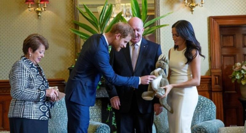 Harry and pregnant Meghan get baby gifts, meet koalas Down Under