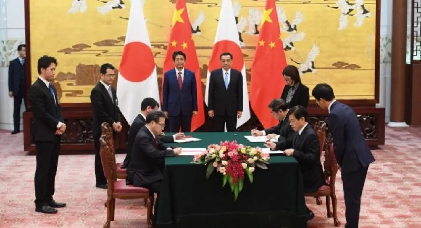 Japan, China strike deals during Abe visit as ties improve Japan, China strike deals during Abe visit as ties improve
