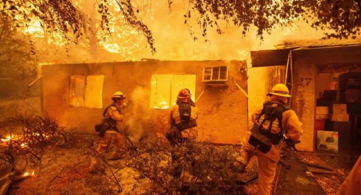 Rescue workers recover bodies in fire-hit California town