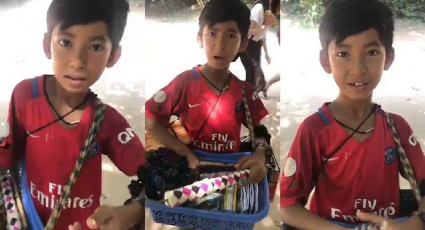 Young souvenir seller shows off linguistic skills