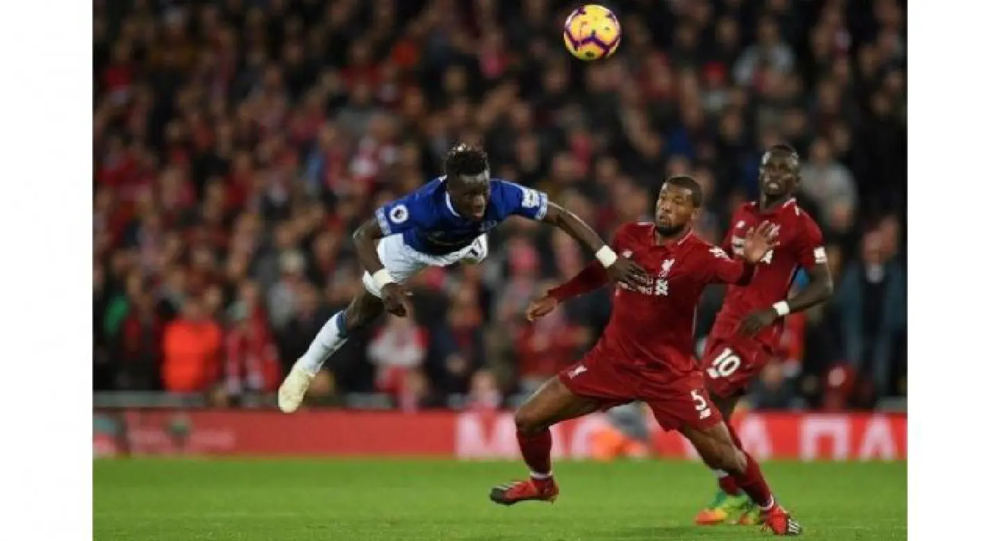 Liverpool stun Everton with freak goal as Arsenal overpower Spurs Liverpool stun Everton with freak goal as Arsenal overpower Spurs