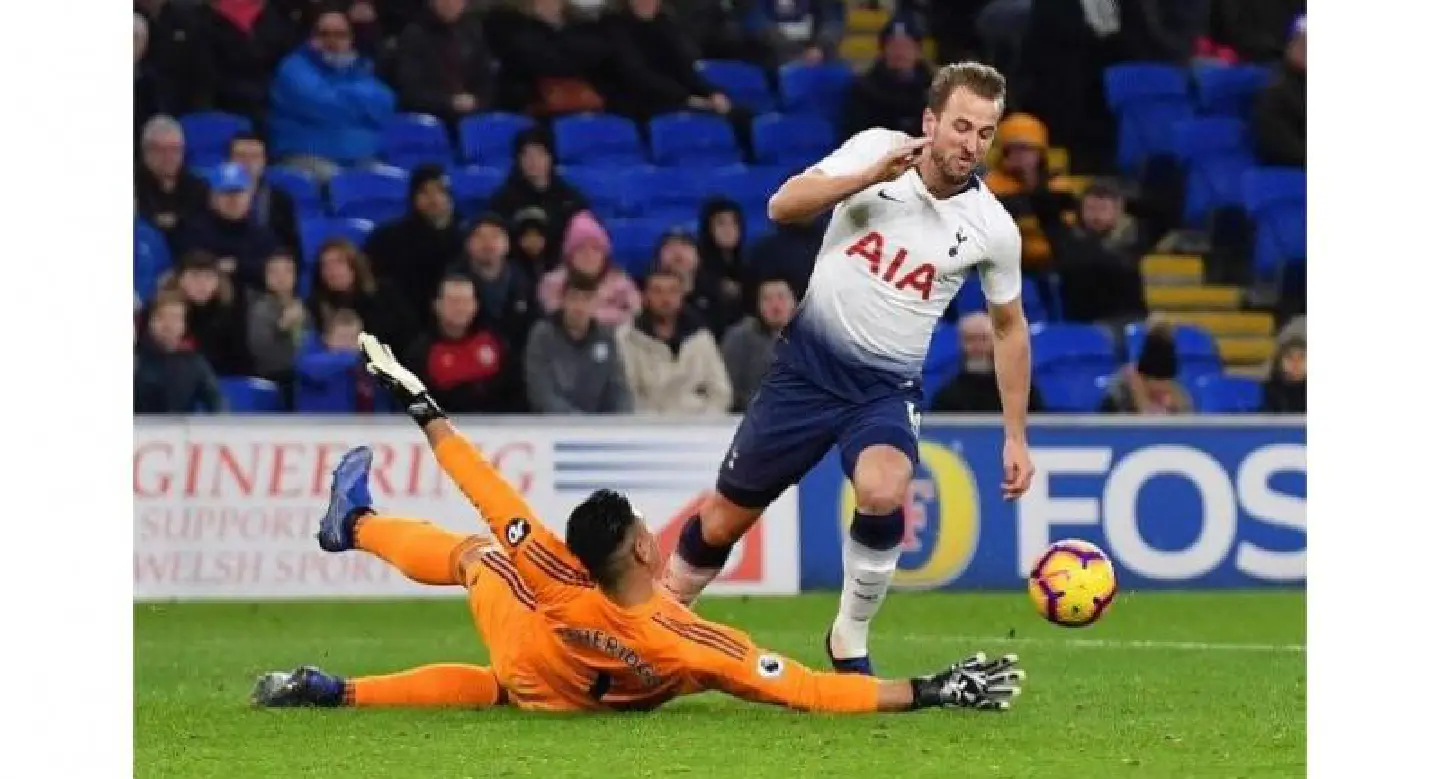 Record-equalling Kane keeps Spurs in title hunt with Cardiff romp Record-equalling Kane keeps Spurs in title hunt with Cardiff romp