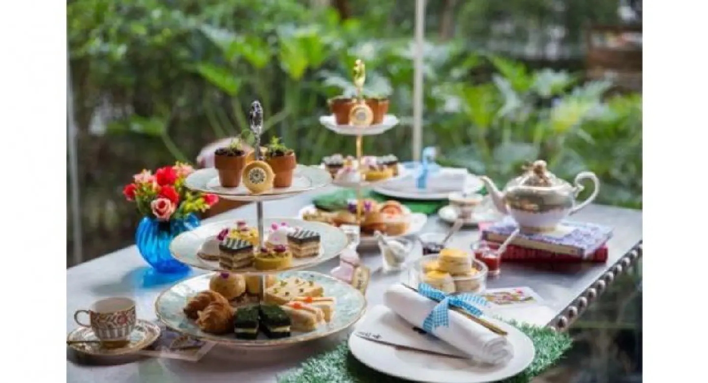 Alice takes her afternoon tea Alice takes her afternoon tea