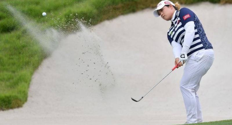 Ariya plays out of a bunker during her one-under round of 71 in Singapore  / Photo by Naratip Golf Srisupab/SEALs Sports Images
