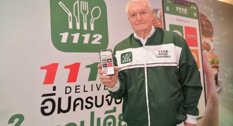 Paul Kenny, chief executive officer of The Minor Food Group, shows off the companyâs 1112Delivery app, which has enabled an expansion in the restaurant operatorâs delivery services.
