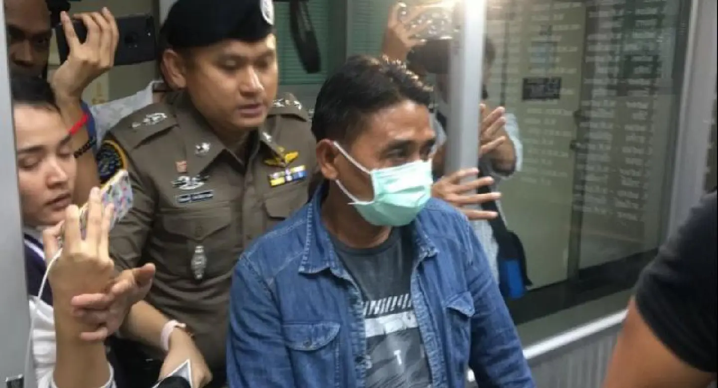 Murder suspect surrenders to police