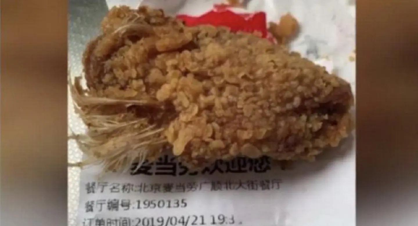 Chinese girl has nightmares after eating McDonald’s chicken wings with feathers still on Chinese girl has nightmares after eating McDonald’s chicken wings with feathers still on