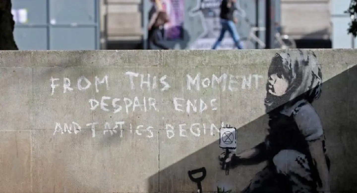 Suspected Banksy work tackles climate protests Suspected Banksy work tackles climate protests
