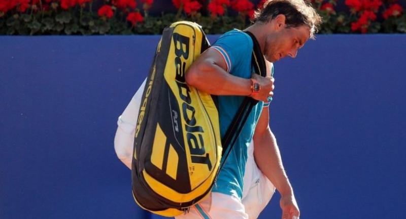 Spain's Rafael Nadal leaves the pitch after losing against Austria's Dominic Thiem. / AFP