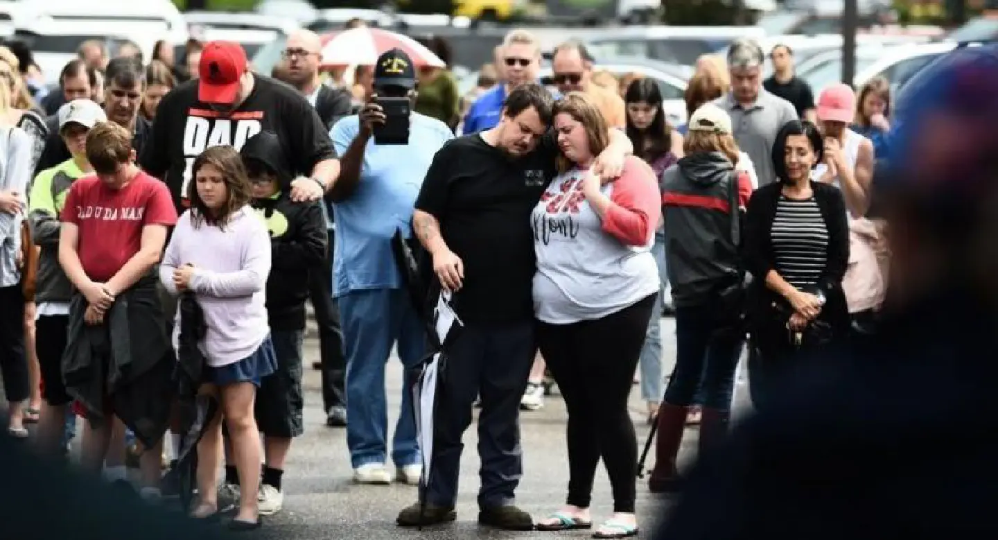 Police search for motive in US shooting that killed 12