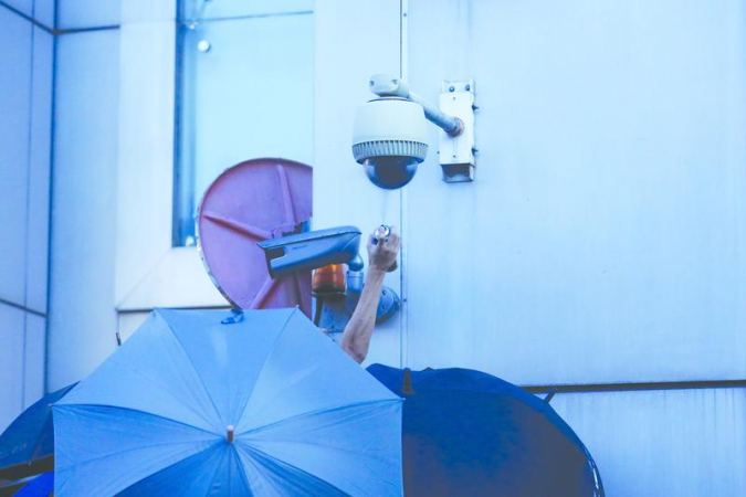 A CCTV camera outside the Liaison Office of the Central People’s Government in the HKSAR is defaced by protesters. (PHOTO BY CHINA DAILY)