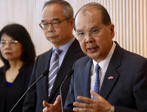  
Hong Kong Chief Secretary for Administration Matthew Cheung Kin-chung (right), Secretary for Home Affairs Lau Kong-wah (center) meet the media at the Central Government Offices, Hong Kong, July 25, 2019. (EDMOND TANG / CHINA DAILY)