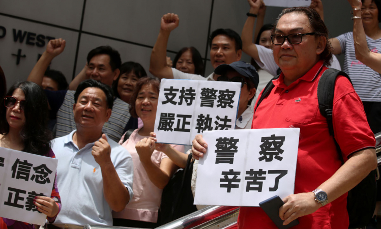 HK urged to oppose violence, focus on growth HK urged to oppose violence, focus on growth