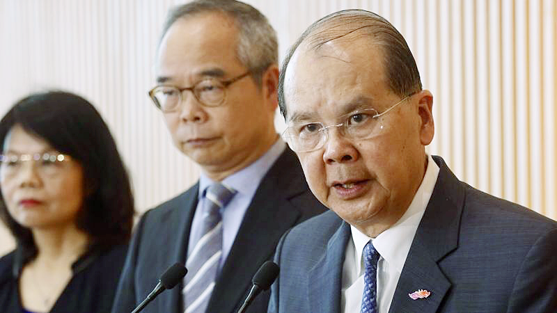 Hong Kong Chief Secretary for Administration Matthew Cheung Kin-chung (right), Secretary for Home Affairs Lau Kong-wah (center) meet the media at the Central Government Offices, Hong Kong, July 25, 2019. (EDMOND TANG / CHINA DAILY)